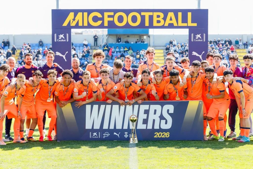 MIC Football tournament winners with the trophy